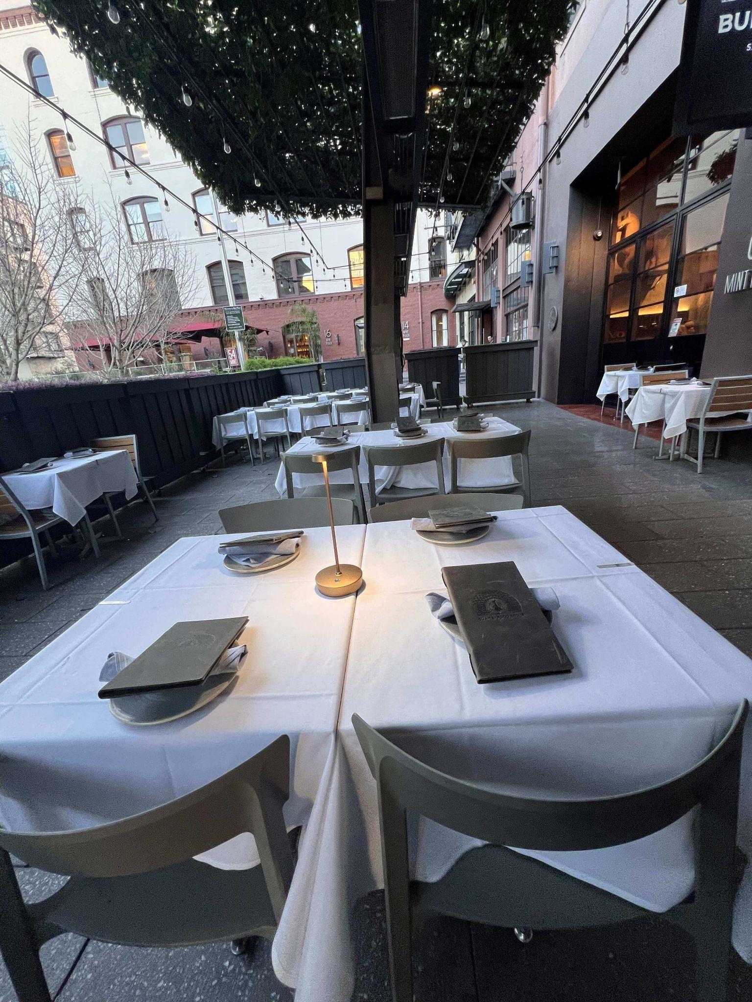 Full Buyout — Burma Love Downtown patio set for a private reception with mobile bar