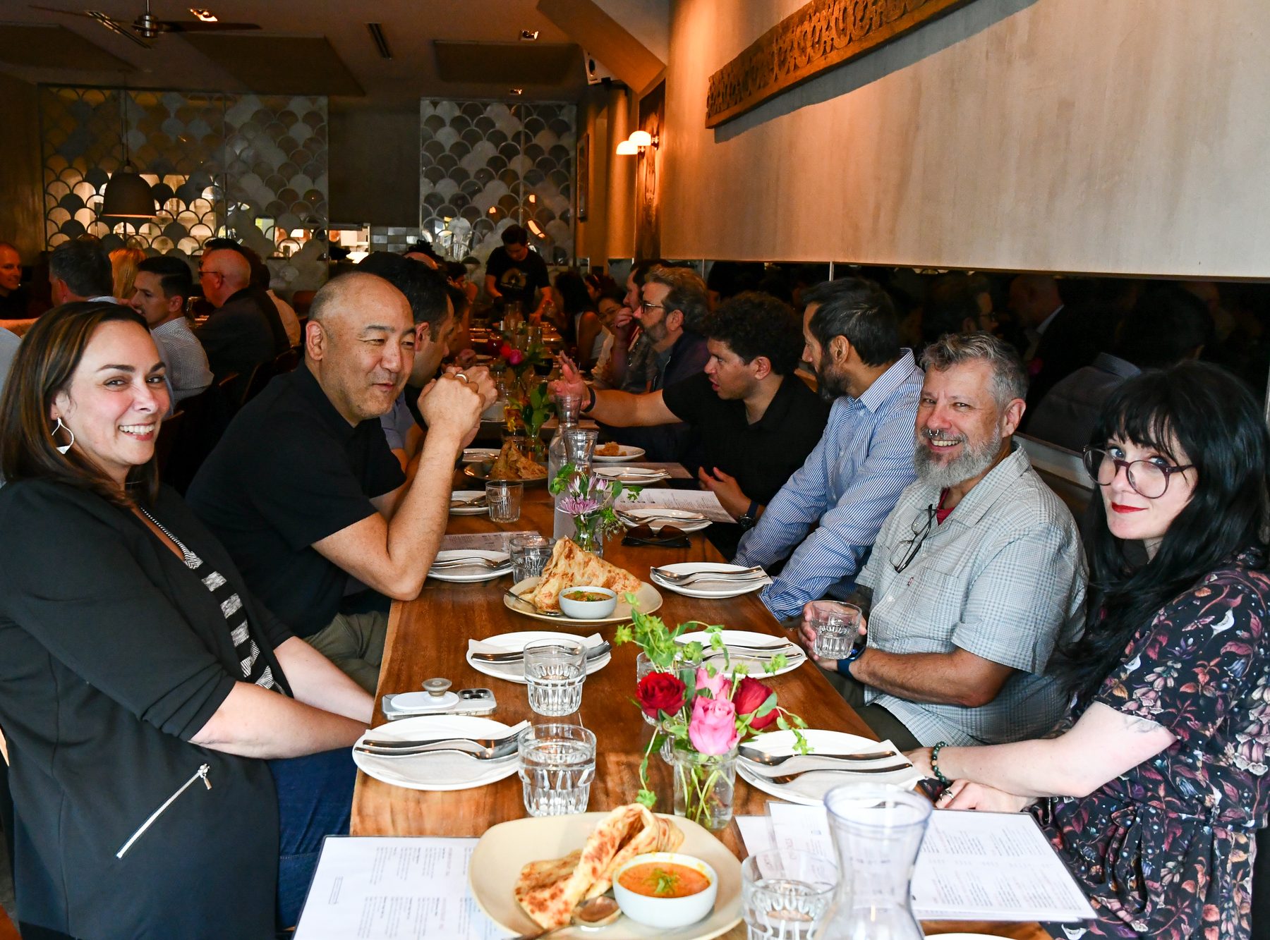 A long table full of friends and food