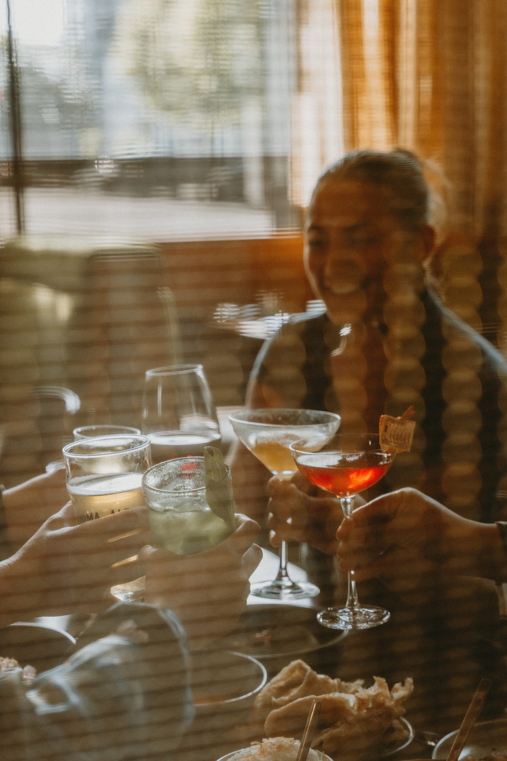 Toasting cocktails in the late afternoon light
